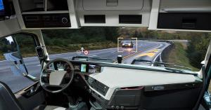 Inside of autonomous big rig on road with on-window display showing where cars are.