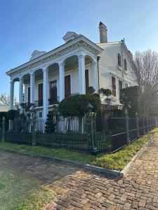 The auction will feature items from the Dufour-Plassan House, a New Orleans landmark building known for its beautiful cornstalk fence.