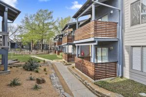 Select units offer balcony views to the property's beautiful green space and resort-style pool.