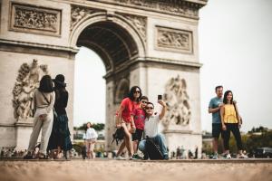 two tourists taking selfies in Paris