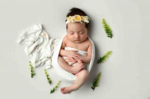 Newborn child photographed by the Barzaq Family, showcasing their unique photographic talent in Gaza