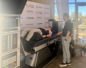 DRX9000 Lumbar with DRX9000C Cervical Spinal Decompression Machine exhibited at OPTA Spring 2024 conference where attendees were able to try the most advanced non-surgical spinal decompression machine in the world.