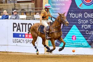 female polo player scores goal