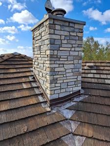 Ramos Masonry stone chimney cap installation