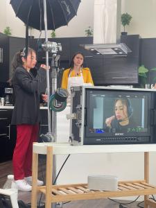In a behind-the-scenes photo, while shooting the project Table 56, Isa Gutierrez's passion for her craft is palpable as she collaborates with the film crew, showcasing her dedication to bringing each scene to life with authenticity and precision.