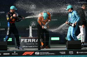 Max Verstappen, Lando Norris and Charles Leclerc celebrate on the podium with Ferrari Trento