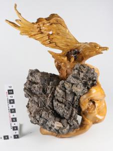 Sculpture made from the polished roots of a Chinese boxwood tree that had grown around a rock, with a carved eagle (or falcon), 17 inches by 15 inches by 26 inches (est. $400-$600).