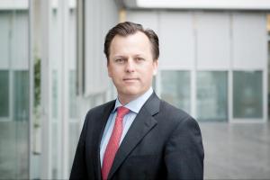 A professional headshot portrait image of Dr. Philip Comberg — an experienced professional in investment, renewable energy and technology — who will serve on Enact Systems' board of directors.