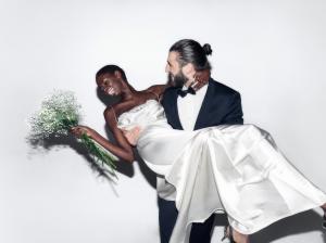 Newlyweds celebrate and pose for the Lovenaire Lounge camera.