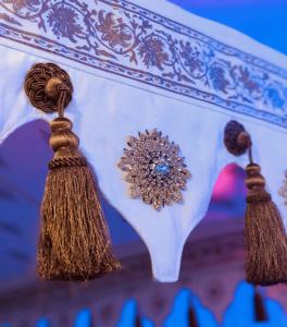 The Victorian tent will have 300 feet of hand stamped 18 Karat Gold Victorian trim, with over 150 four-inch flower appliques and 300 gold tassels hand sewn around the border.