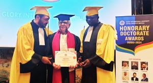 Aslam Shems receiving the Doctorate from the Glory University Jury