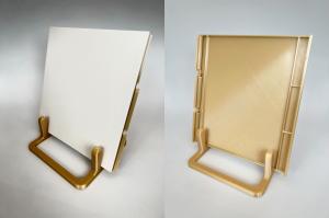 Image showing the front and back of a 3d printed panel for aircraft cabin interiors.