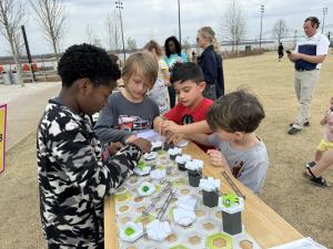 Students conducting a science experience in Tom Lee Park