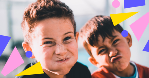 Two young boys pull funny faces