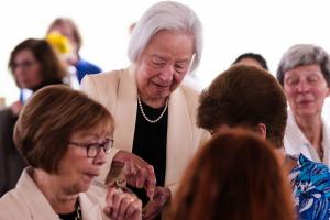 The Salute to Mothers Founder, Betty Tsai pouring tea for guests at the Bucks County Community College afternoon fundraiser for student mothers. Photo Credit: Contributed.