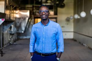 Baobab Fare co-founder Hamissi Mamba stands in the Eastern Market space that will soon be a brick-and-mortar of Baobab Fare's street food sister brand, Waka.