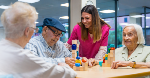 A caregiver at an adult care centers, assisted living communities, or nursing home working with clients after using the Rosemark Facilities Management tool to clock into her shift