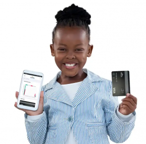 Little black girl with huge smile on her face holding Life Hub Visa Debit Card and Life Hub Mobile App