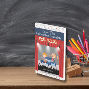 Friendship Bracelet coloring book for kids ages 4 and up on a school table in front of a blackboard and next to a pencil cup full of colored pencils. The cover of the book has a cartoon young girl and boy on a stage under a spotlight surrounded by thick v