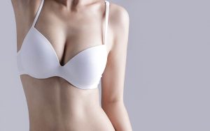 Image of female torso wearing white bikini top