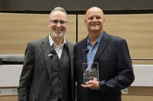 Cy-Fair Federal Credit Union president and CEO Cameron Dickey and Dr. Mark Henry, recently retired superintendent of Cy-Fair Independent School District, with the inaugural Community Quill Award.