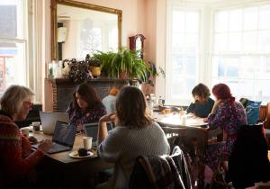 A group of writers at a Writers' HQ real life retreat