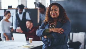 Woman Business Owner with Team Behind her