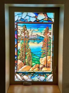 AI art recreating the look of stained glass printed on window film for a hall window.