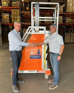 Bruce Senior and Brett Waggoner in front of the "Squirrel" model of Equiptec's Adjustable Height Platform.