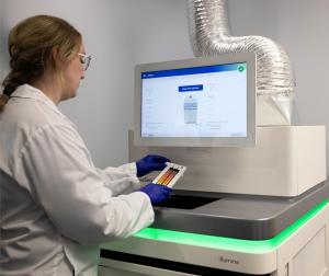  eDNAtec sequencing team lead Emily Porter operates the Illumina NovaSeq 6000 ultra-high-throughput DNA sequencing platform.