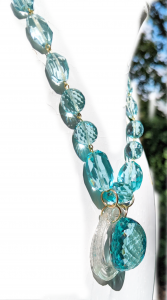 Aqua beaded necklace with a center aqua bead