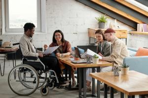 A group of young adults, some with disabilities, living and working together