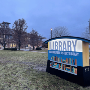 The library entrance with open doors, inviting visitors to explore its vast collection of books and resources.