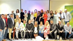 Estela Salinas standing with colleagues from Mannatech in a group photo