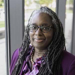 Current day headshot of Dr. Menah Pratt a black women scholar and writer