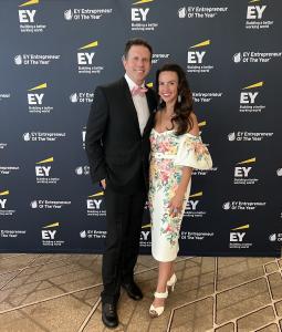 Lindsay Fork, Founder + CEO of Luxe Brands, stands to the right of her husband, Kurt Ruen, at the Ernst + Young Entrepreneur of the Year Event