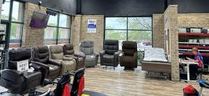 This photo show the spacious Inside of the showroom, with recliner lift out chairs and home use hospital beds.