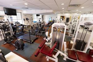 Interior view of NYMDC gym area with various fitness machines and equipment for physical therapy.