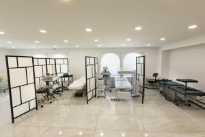 Modern treatment area at NYMDC with private sections and advanced medical equipment for patient care.