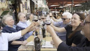 Group of retirees toasting at lunch in Florence Italy