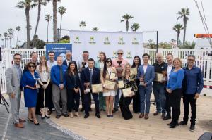 Group of people holding awards