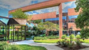 A glass building for the lobby and attached a brick building 3 stories tall. Home of 911 Tax Relief Law