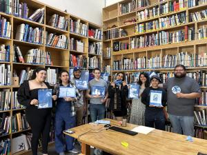 Students Holding Prints at Art Division