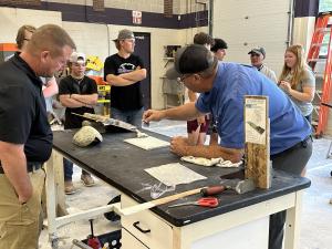 David Croteau leads hands-on stone installation demonstration at Shawsheen Tech.