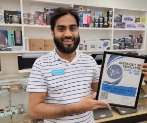 Computers Repair Plus Electronics - an employee holds a Certificate of Excellence from Best Pros In Town