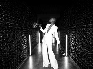 A woman standing in a wine cellar