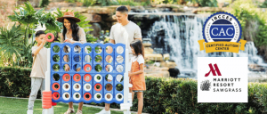 Family enjoying a game of connect the dots by a fountain outdoors.