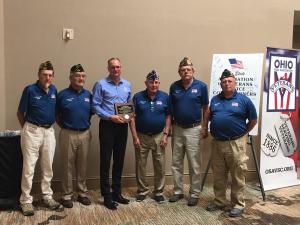 Bryan Keller pictured with Defiance County Veterans Service Commissioners holding award