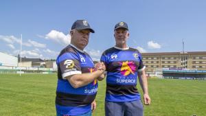 Dom Einhorn and David Ellis on a rugby pitch in the south of France