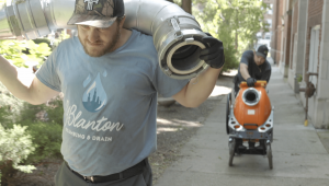 J. Blanton Plumbing technicians working on a trenchless sewer repair job, illustrating their expertise in sewer line maintenance and sewer repair.